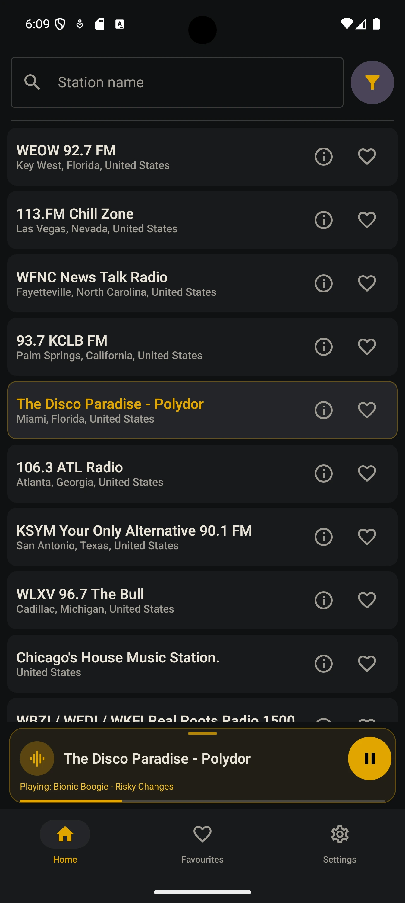 The compact mini player bar at the foot of the station list, still playing while the list is browsed